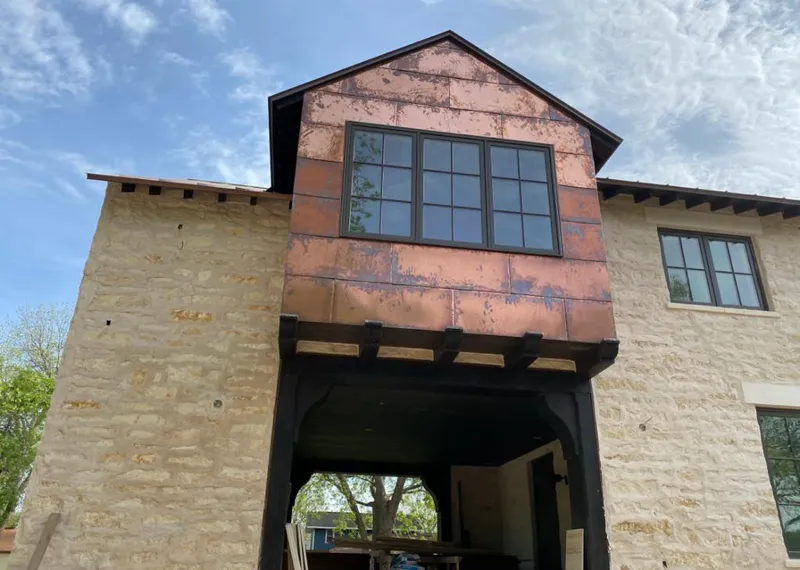 Copper metal panel facade on a stone building for Metal Roof Coating in Midvale
